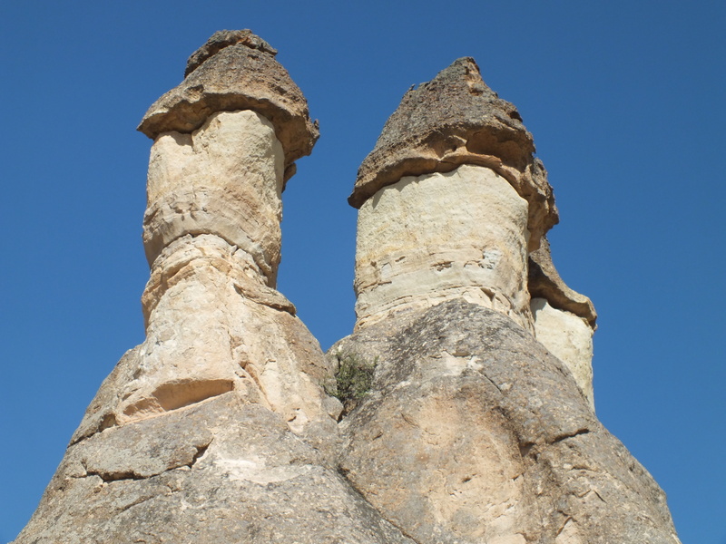 rock - object, no people, sky, sunlight, eroded, low angle view, outdoors, erosion, sandstone, rock formation, arid climate, history, nature, solid, geology