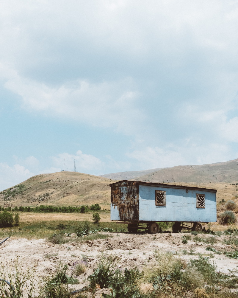 hill, old, environment, nature, abandoned, grass, mountain, day, trailer, obsolete, land, mode of transportation, non-urban scene, sky, cloud - sky, field