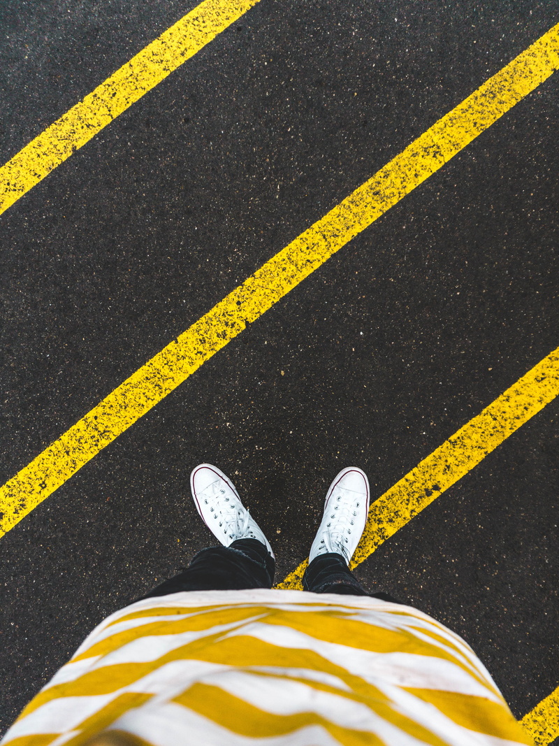 dividing line, low section, body part, yellow, low, one person, day, human limb, converse, person, human body part, fashion, rain, marking, asphalt, sneakers