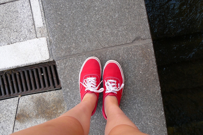day, perspective, red, shoe, person, woman, human Foot, read, away, road, leisure activity, topping, outdoors, nail, sidewalk, directly above, pavement