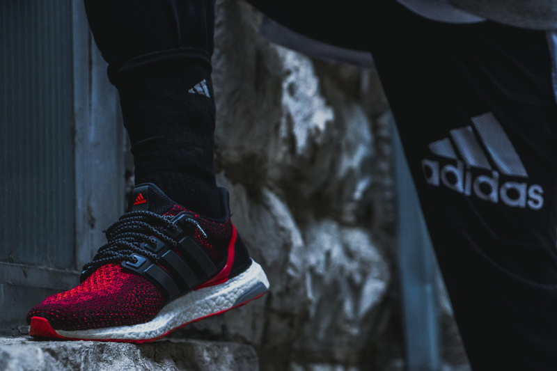 winter, clothing, human foot, feet, sneaker, human body part, wearing, text, human limb, adult, cold temperature, glove, sport, black, lifestyles, person