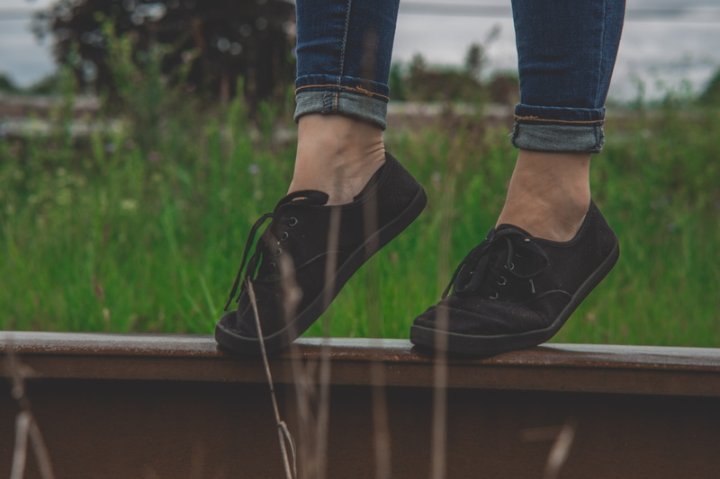 lifestyle, leisure activity, sneakers, low section, footwear, leisure, candid, grass, human foot, railroad track, low, relaxation, wear, standing, woman