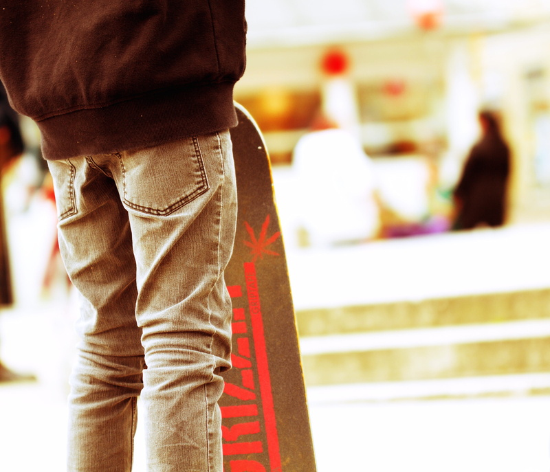 focus on foreground, human limb, real people, adults only, photography, fun, day, casual clothing, incidental people, skateboard, rear view, jeans, people