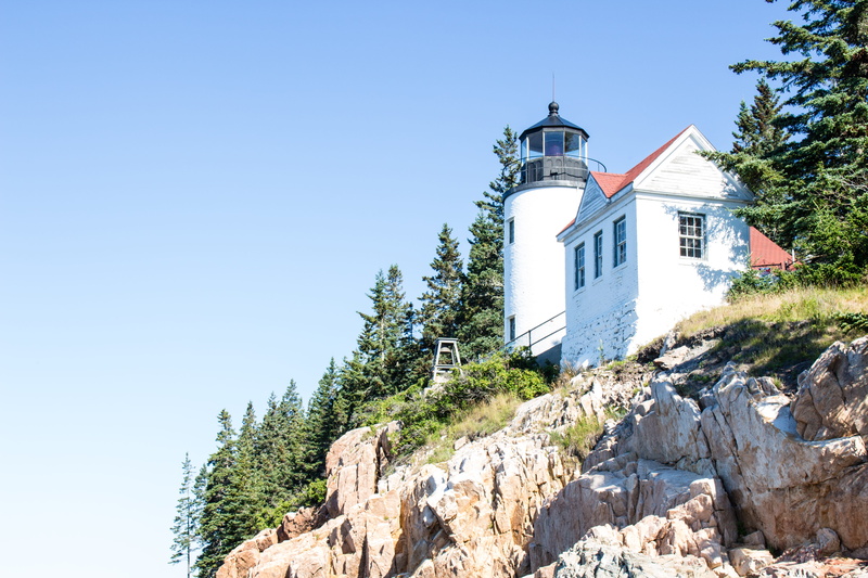 day, belief, bass harbor head lighthouse, trees, building exterior, no people, religion, low angle view, outdoors, rugged coast, united states, blue, place of worship
