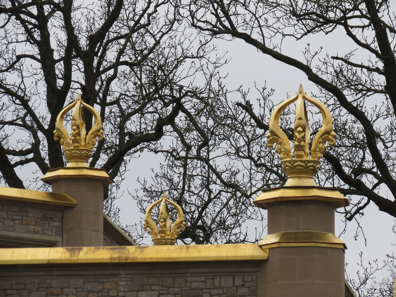 religion, sky, ornate, sculpture, five pronged vajra, architecture, bare tree, creativity, human representation, branch, temple, no people, built structure