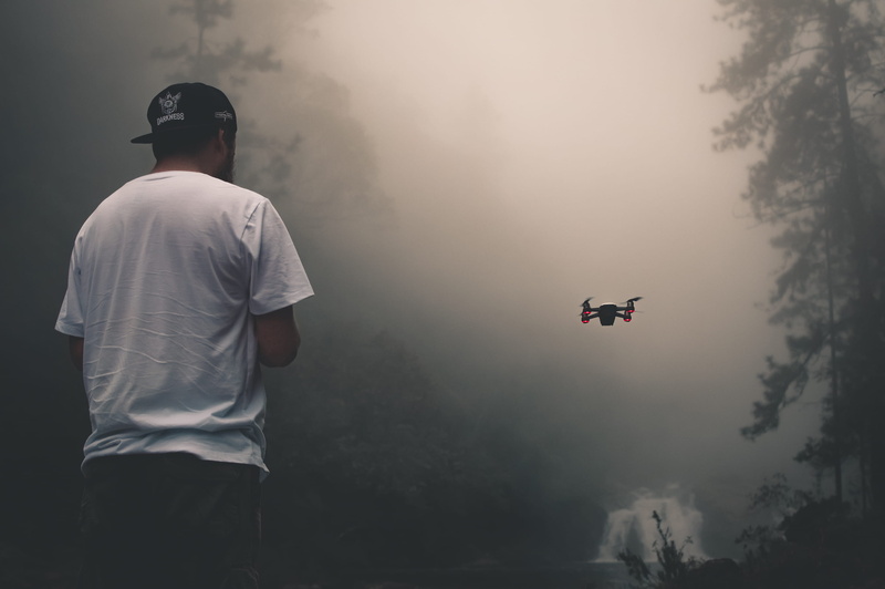 tree, cap, mode of transportation, facing, occupation, people, mid-air, hat, sky, near, airplane, rear view, person, serjosoza, air vehicle, man, lifestyles