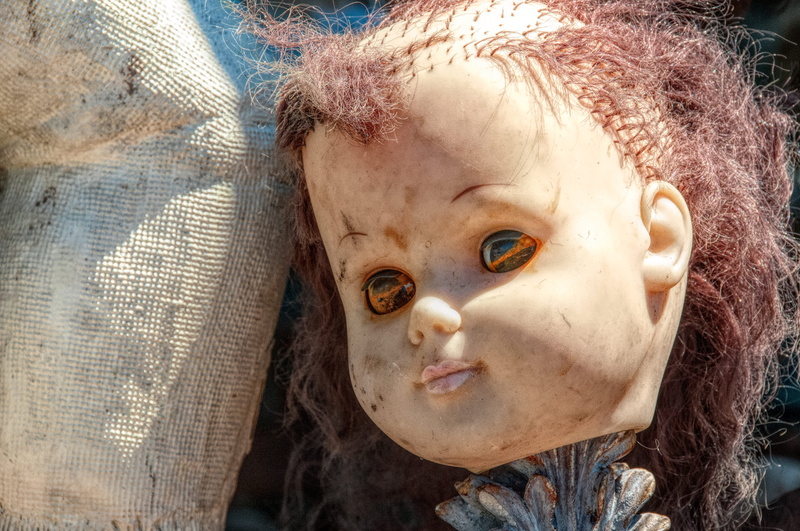 scarry, real people, females, childhood, close-up, evil, eyes, cute, dirty, portrait, doll, broken, child, hairstyle, front view, indoors, messy, innocence