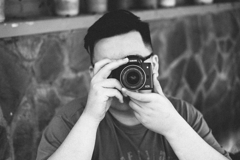 grayscale, photography themes, camera - photographic equipment, 4K, camera, digital camera, m50, man, focus on foreground, headshot, holding, photographing