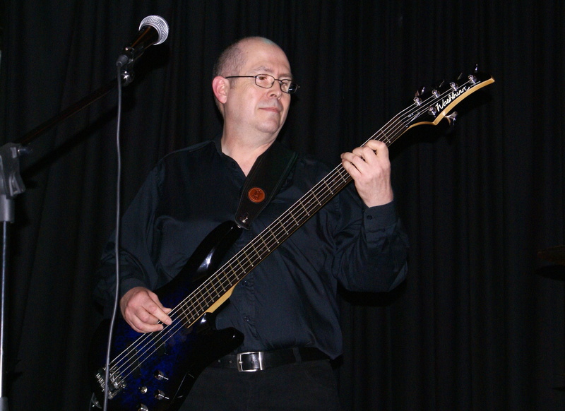 performance, washburn, 5 string bass, stage, skill, rock musician, glasses, bassist, music, waist up, adult, mature adult, musician, musical equipment