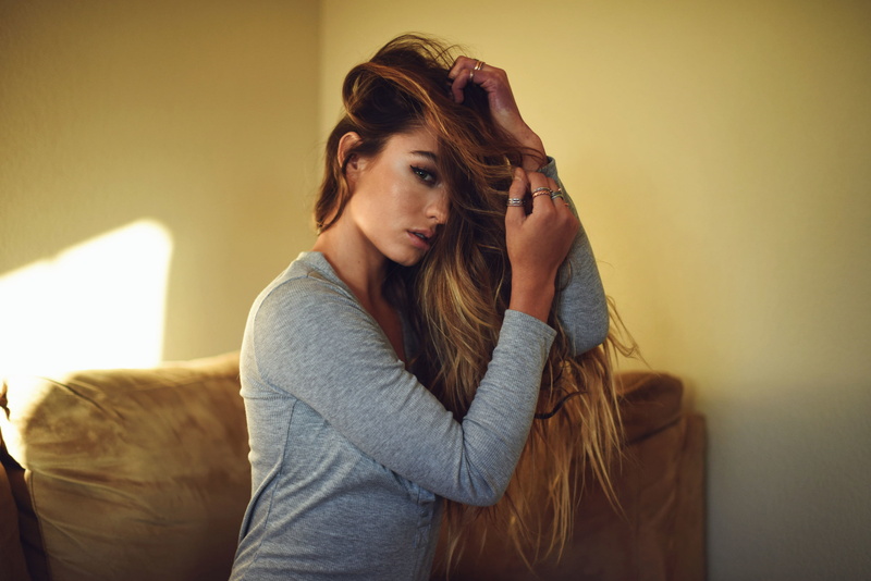 model, women, Sommer Ray, hair in face, brunette, couch, long hair, women indoors, 1080P, rings, looking at viewer, hands in hair