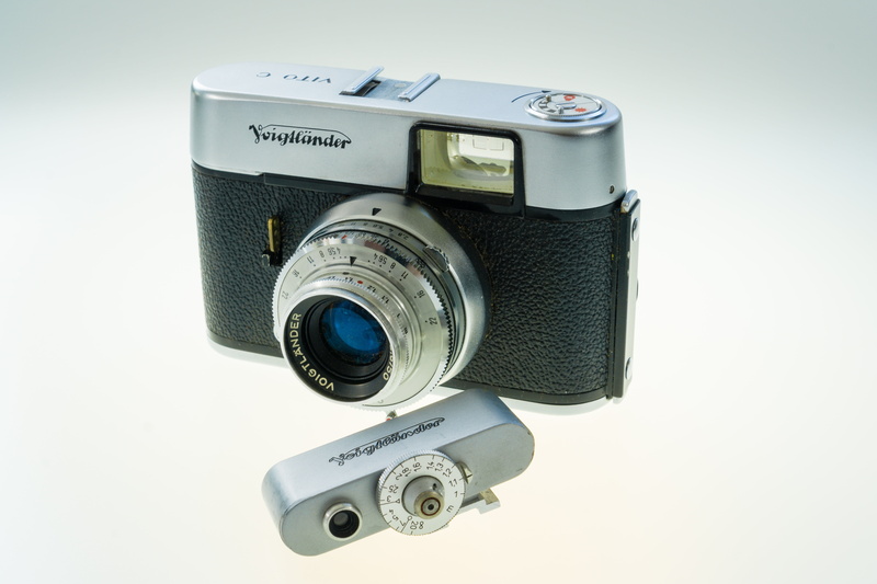 slr camera, 60s, indoors, close-up, camera, retro styled, white background, 5K, camera - photographic equipment, no people, old, finance, voigtlander
