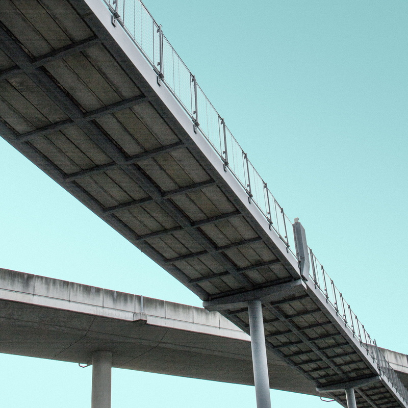 steps and staircases, staircase, low angle view, overpass, gray, copy space, sky, wall, bridge, railing, clear sky, day, eyeview, building exterior, suspension