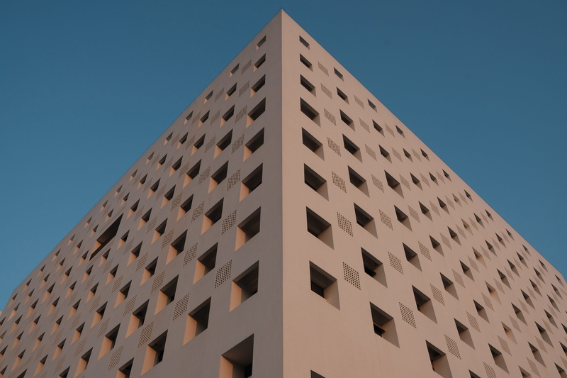 office building exterior, repetition, 5K, no people, clear sky, building, outdoors, sky, window, nature, building exterior, tall - high, low, modern, tower