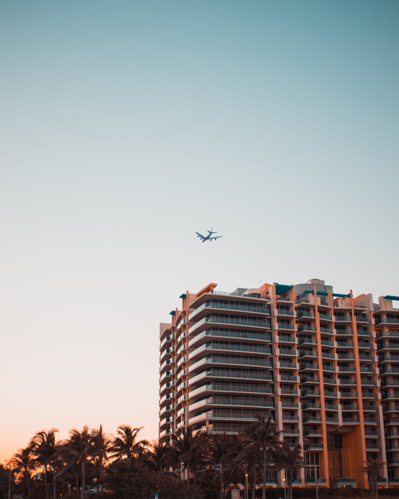 worm, eyeview, transportation, mid-air, flying, no people, aerospace industry, air vehicle, building exterior, building, s, copy space, clear sky, low angle view