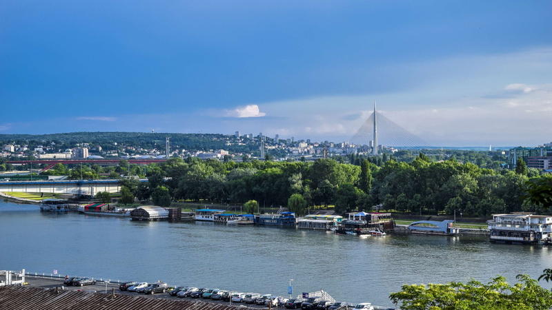 sailboat, connection, cityscape, architecture, city, day, river, trees, outdoors, sky, tree, nature, water, built structure, new, blue sky, nautical vessel