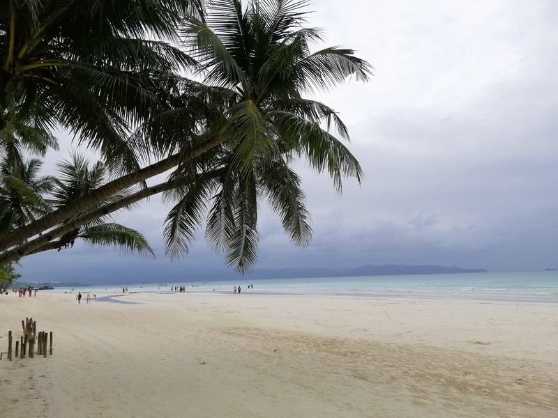 beach, land, outdoors, incidental people, beauty in nature, cloud - sky, plant, rain, horizon, horizon over water, tree, tropical, sky, palm tree, water