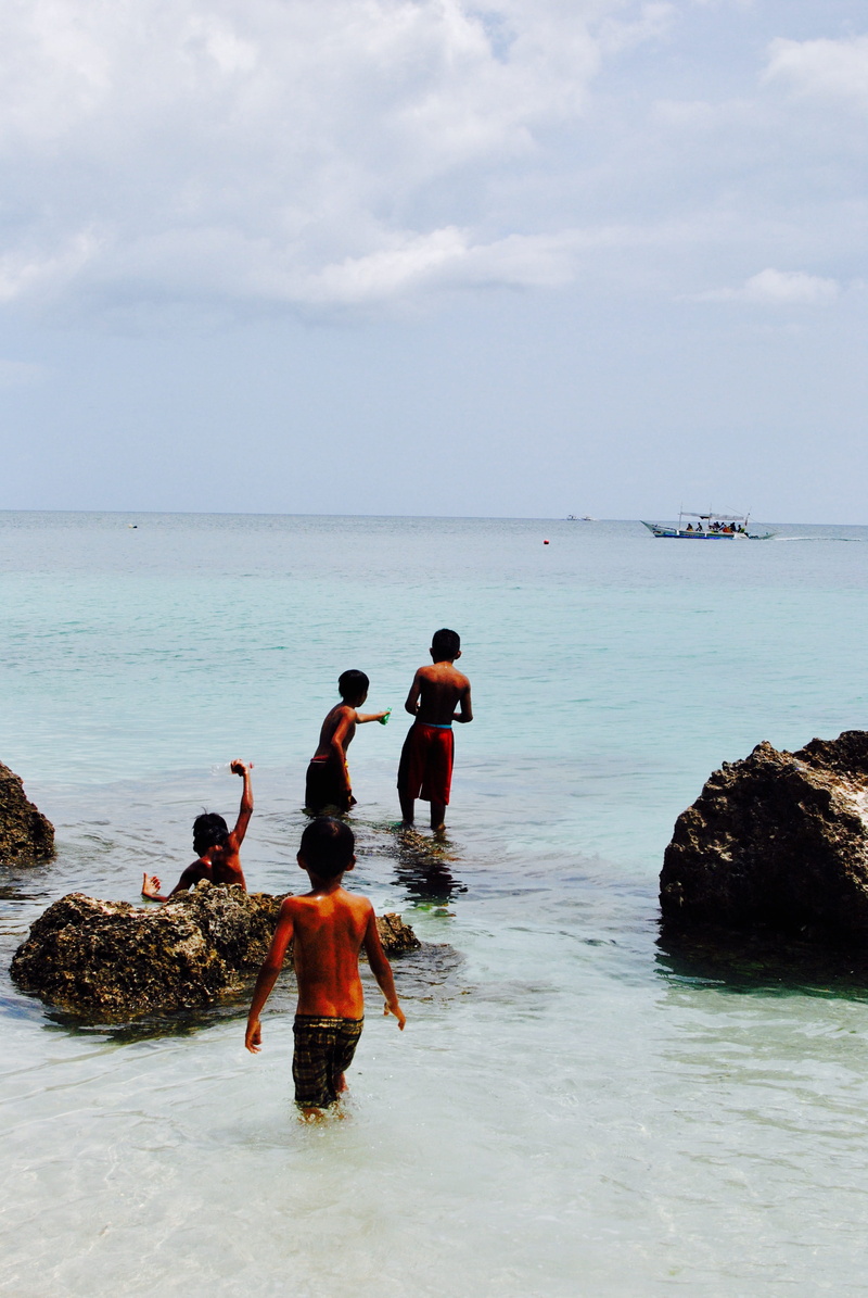 candid, waterfront, boracay, water, holiday, leisure activity, outdoors, boys, day, group of people, beauty in nature, cloud - sky, horizon over water