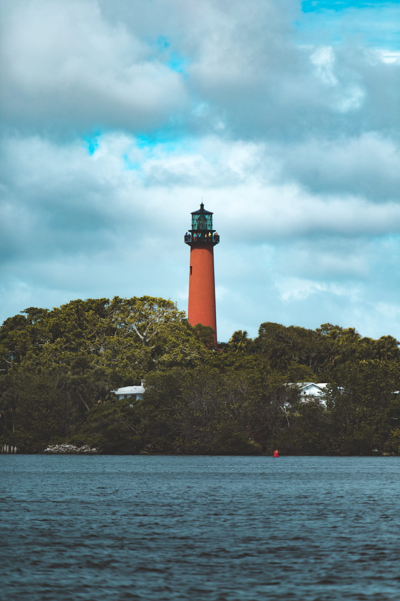 tower, water, summer, waterfront, protection, built structure, no people, building, guidance, cloud - sky, sea, direction, jupiter, jupiter lighthouse park