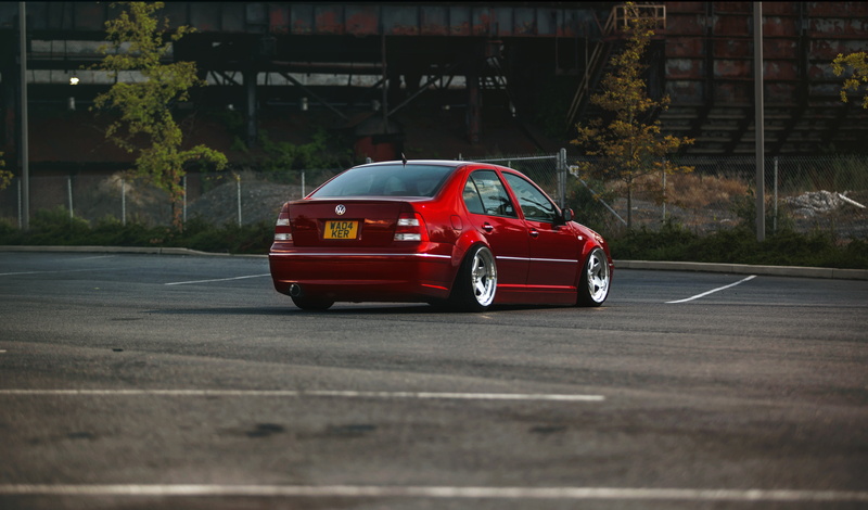 red, plant, sedan, no people, outdoors, street, jetta, tuning, 5K, motion, motor vehicle, car, road, mode of transportation, built structure, nature, transportation