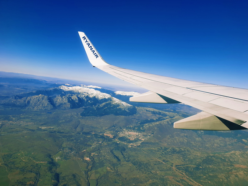airplane, aerial view, daytime, bird, vehicle, nature, on the move, transportation, mid-air, sky, blue, outdoors, gray, takeoff, private airplane, adventure