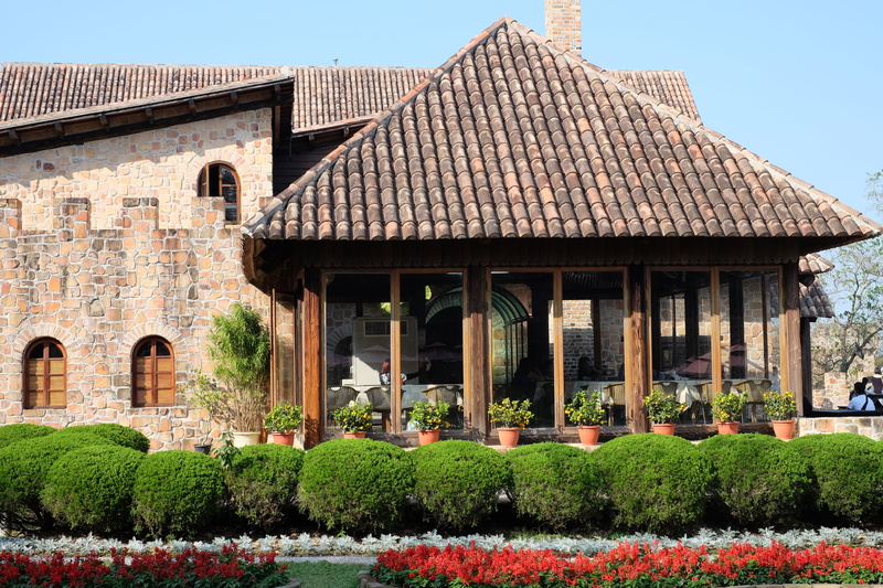 home, landmark, clear sky, family, potted plants, brick, flower, grass, hedge, bungalow, traditional, built structure, plants, travel, plant, architecture
