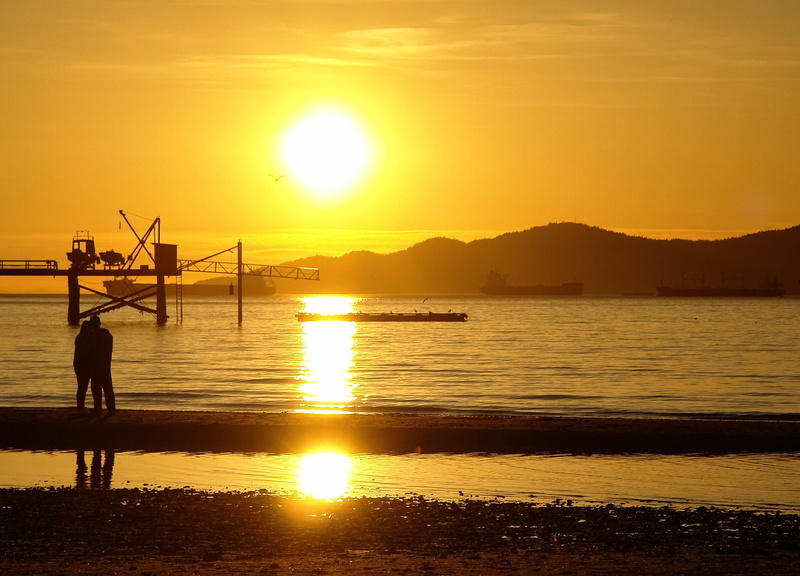 sky, real people, tranquil scene, water, outdoors, sun ray, vancouver, scenics - nature, idyllic, kitsilano beach, one person, beach, lens flare, beauty in nature