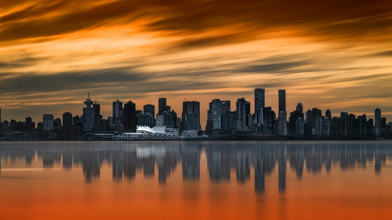 no people, architecture, urban skyline, orange sunrise, outdoors, office building exterior, orange color, water, built structure, modern, sunset, landscape