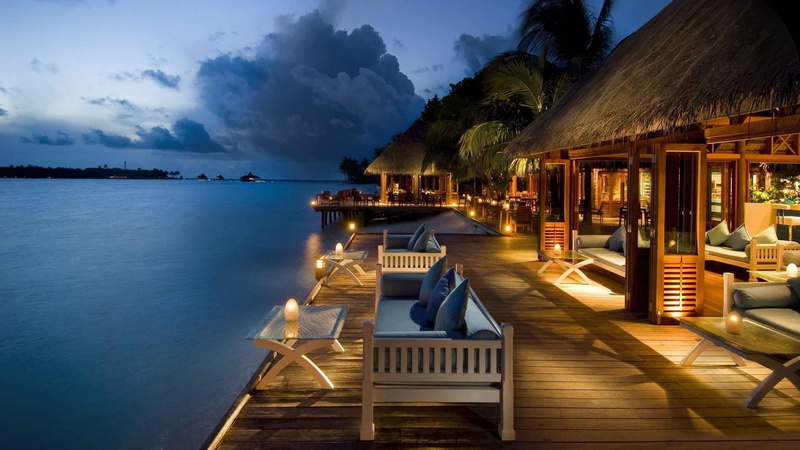 sea, evening, seashore, holiday, no people, outdoors, travel, tranquil scene, seat, tranquility, land, sky, scenics - nature, chair, wood, dusk, bungalows