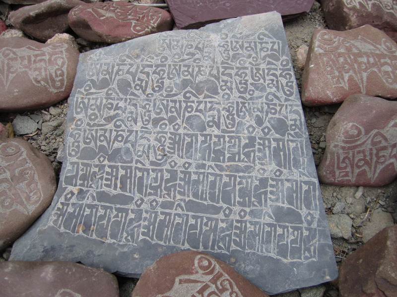 rock, writing, pattern, stone, high angle view, body part, one person, close-up, pierre, text, abundance, large group of objects, characters, indoors, 4K
