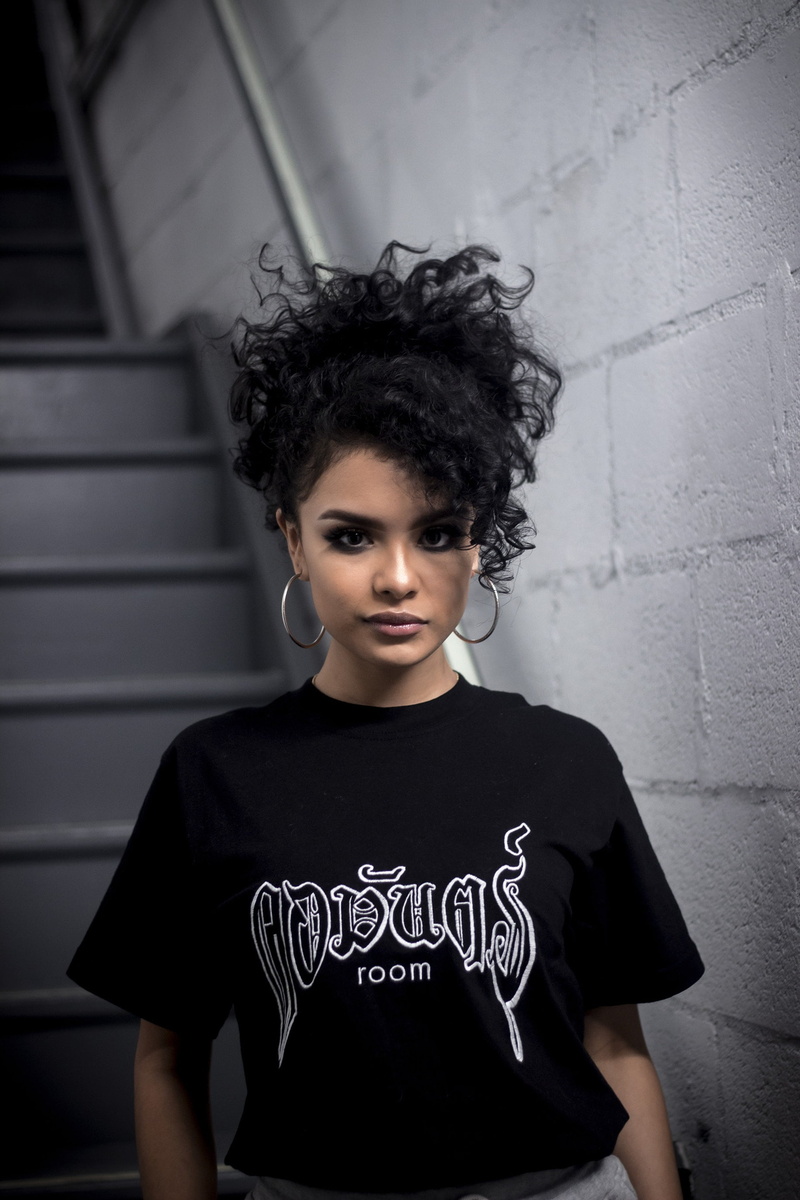 black t-shirt, dress, adult, hairstyle, beautiful woman, hoop earrings, portrait, standing, black color, front view, beautiful people, hair, beauty, looking at camera