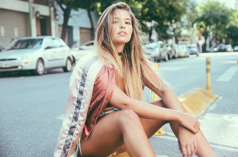 outdoors, hairstyle, portrait, jacket, one person, women, blond hair, long hair, brown eyes, lifestyles, blonde, jean shorts, young adult, teenager, young women
