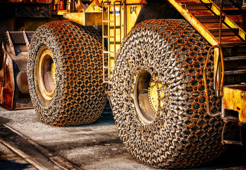 built structure, metal, road, nature, 5K, sunlight, yellow, huge, tire, land vehicle, wheel loader, creativity, factory, tractor, architecture, snow chains