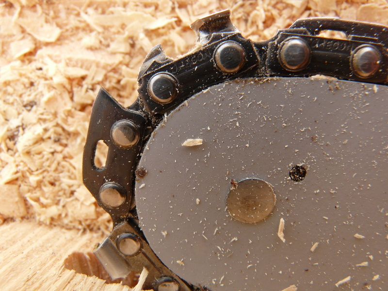 black color, growing stock, timber, risk of injury, selective focus, day, rusty, no people, old, firewood, dangerous, logging, risk, chain, high angle view