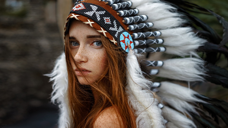 feathers, headdress, 1080P, model, women, looking at viewer, outdoors, Native American clothing, redhead, hair in face, closeup, women outdoors, Georgy Chernyadyev
