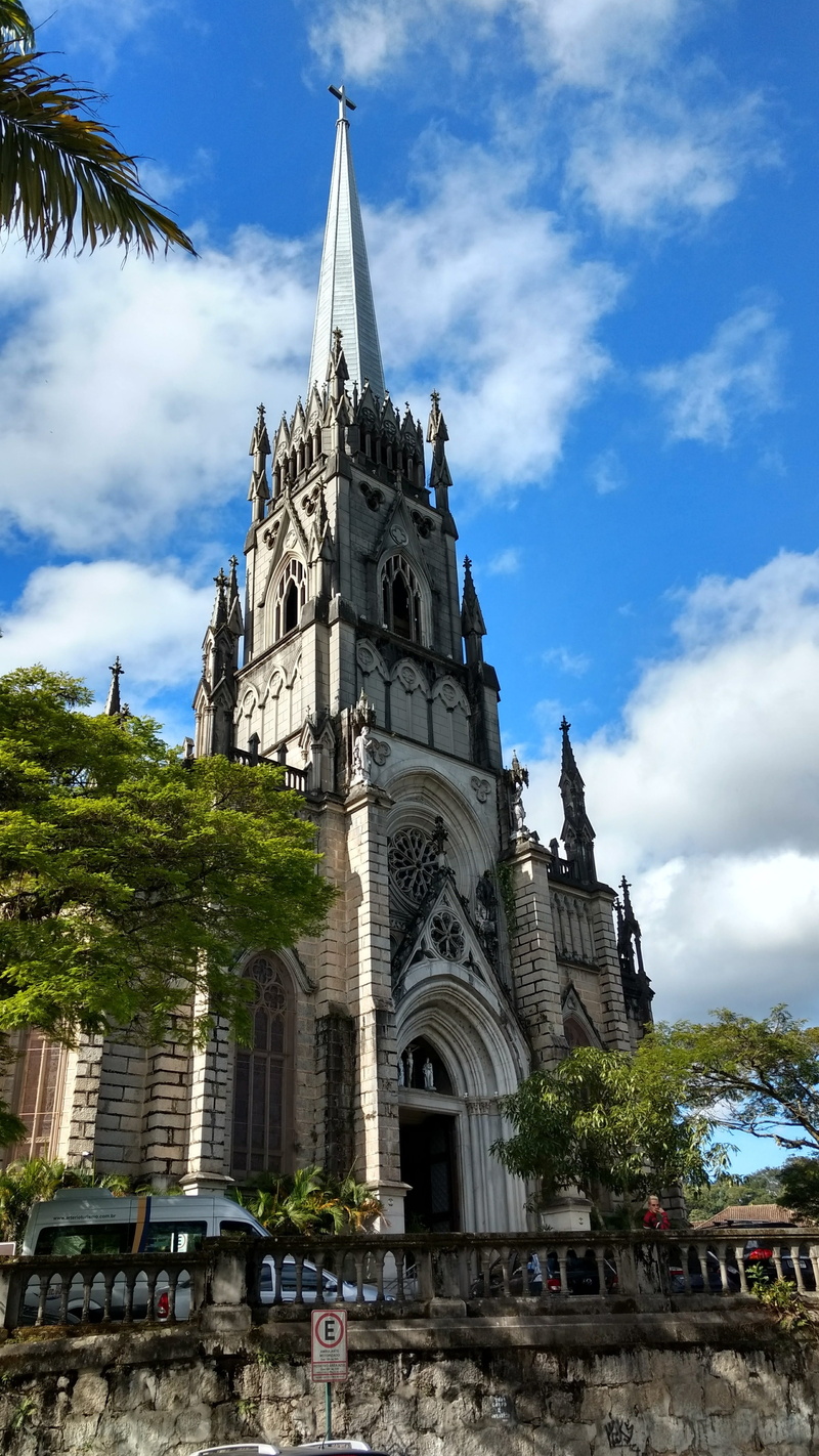 sky, spire, nature, tree, building exterior, outdoors, built structure, low angle view, building, architecture, spirituality, mountain town, day, religion