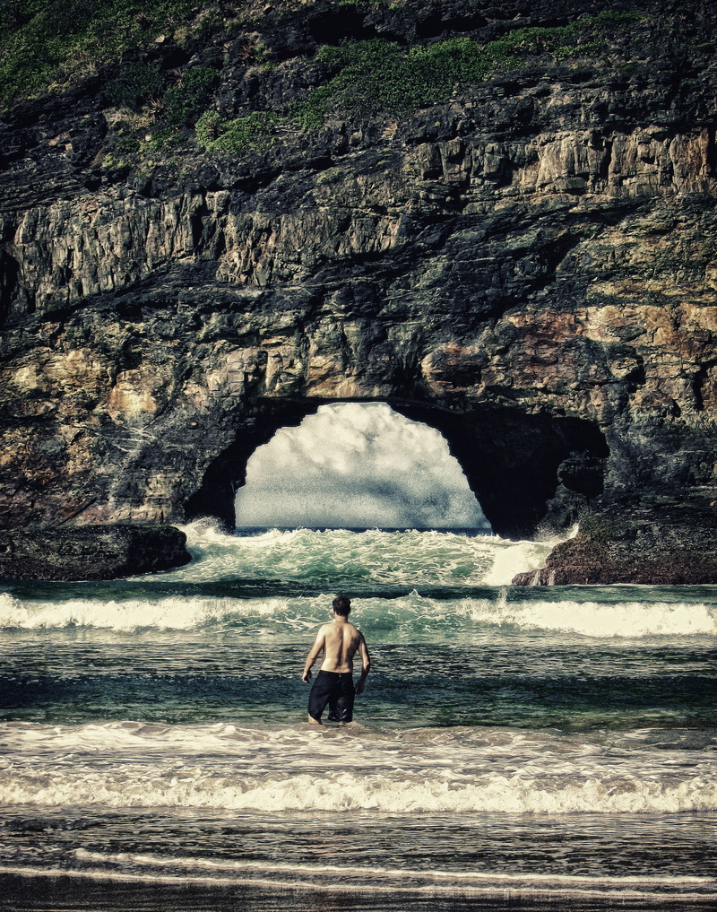 ocean, scenics - nature, outdoors, hole in the wall, hole, determination, leisure activity, vacations, land, lifestyles, motion, one person, wild coast