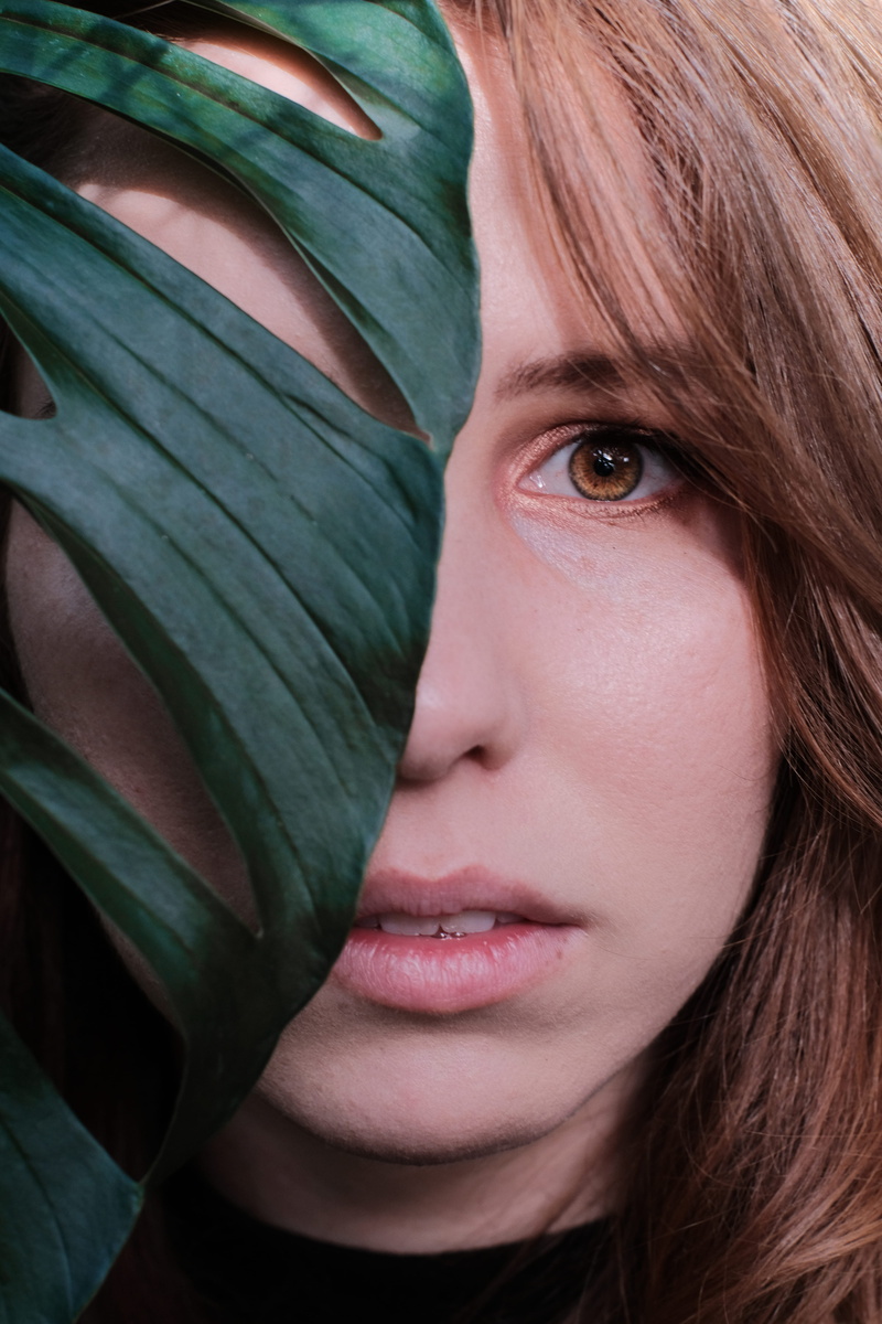 lifestyles, behind, women, body part, cheese, human face, green, human body part, close-up, one person, leaf, real people, headshot, woman, swiss, plant