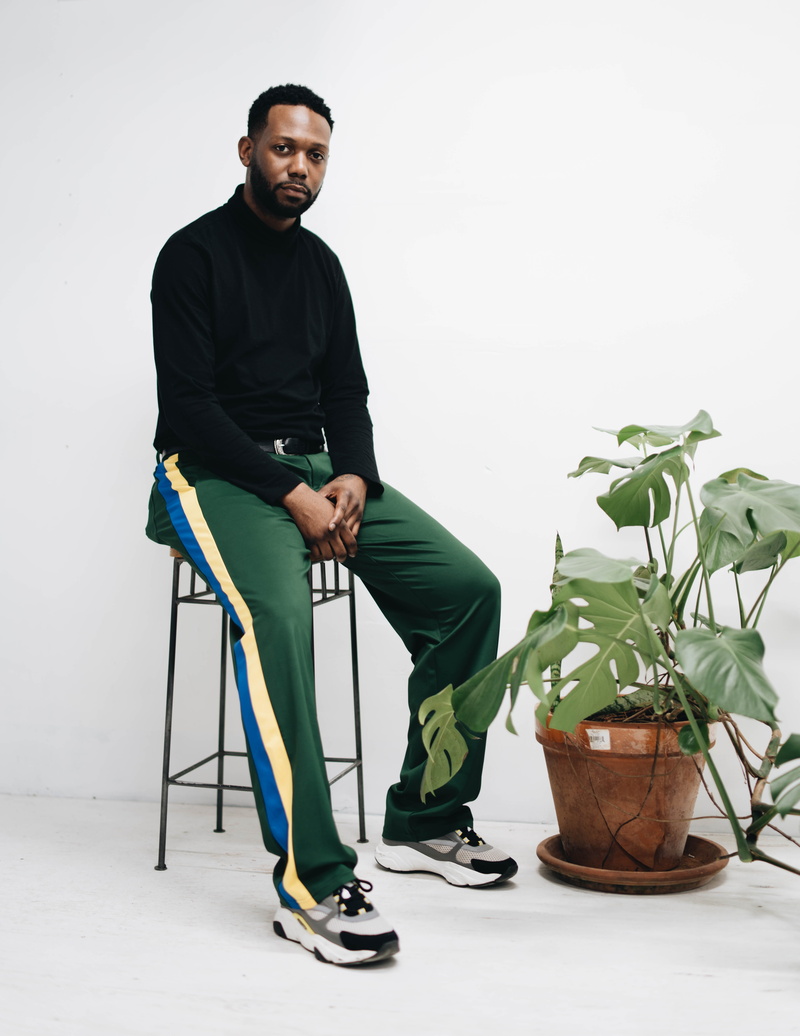 plant, man, young men, green color, white background, indoors, men, potted plant, looking, 5K, real people, beside, cheese, swiss, mid adult, stool, young adult