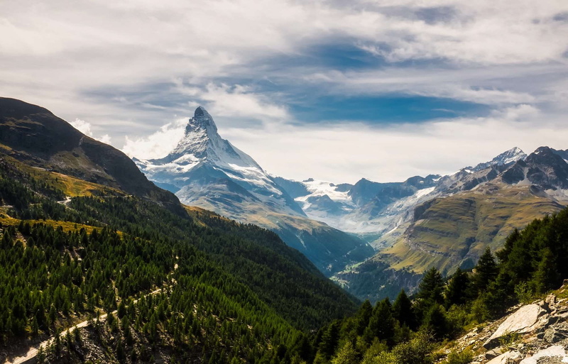 no people, road, mountain peak, environment, tourism, mountain range, valley, matterhorn, cloud - sky, tranquil scene, scenics - nature, woods, trees, switzerland