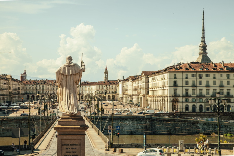 travel destinations, tourism, male likeness, city, italy, art and craft, roman, built structure, near, urban Scene, daytime, representation, sky, nature