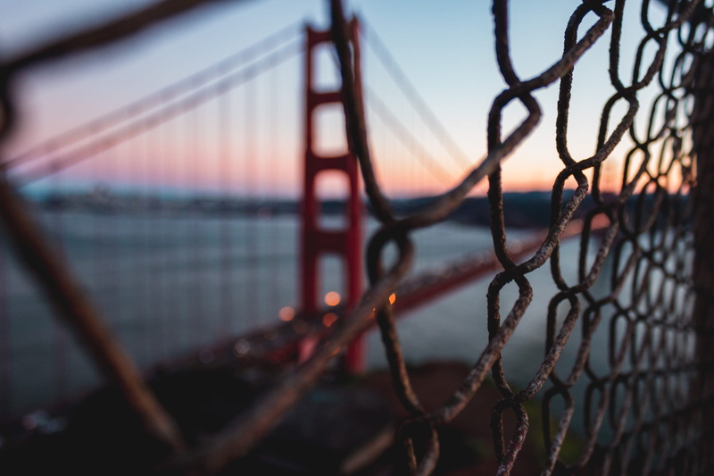 sunset, connection, rust, fence, sphere, bridge - man made structure, wire, gate, banister, water, barrier, architecture, flare, chain, grille, bridge
