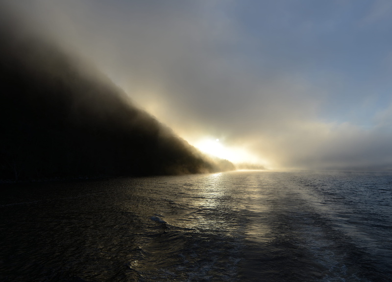 mountain, no people, tranquil scene, sunrise, monitor, light, horizon over water, nature, waterfront, storm, tranquility, flare, power in nature, sea, reflection