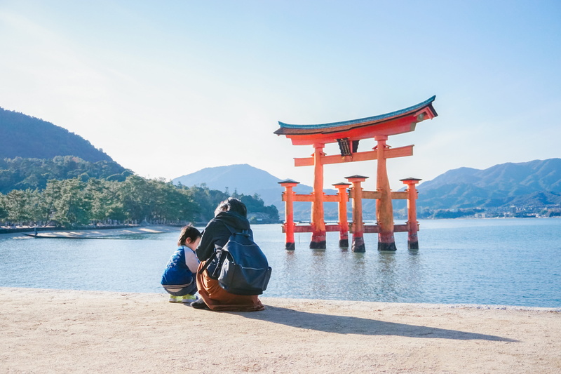 belief, outdoors, real people, two people, ocean, mountain range, gate, scenics - nature, toddler, men, human, shrine, woman, leisure activity, sky, lifestyles