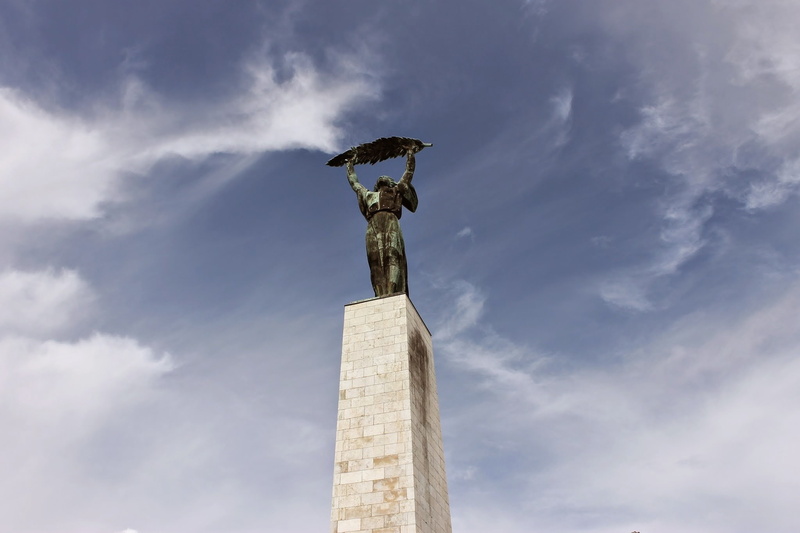 craft, outdoors, sky, statue, low angle view, art and craft, architectural column, creativity, travel, architecture, day, human representation, female likeness
