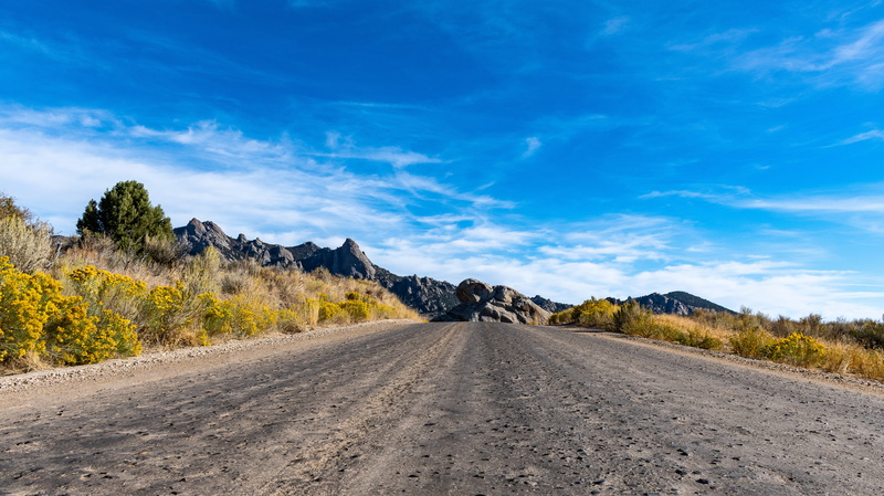road, day, non-urban scene, direction, daylight, blue, mountain, environment, 5K, beauty in nature, flowers, rocks, plant, scenic, cirrus, grass, clouds