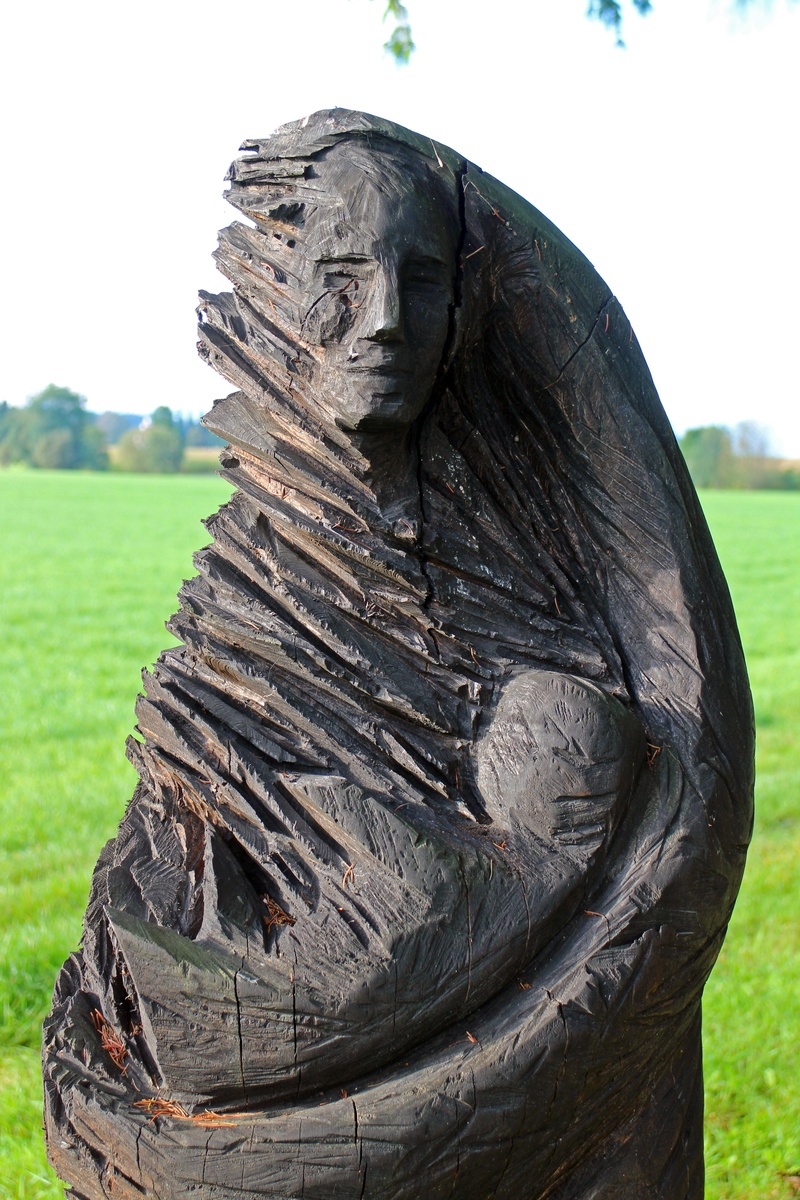 chainsaw, human representation, sculpture, nature, wood work, art, wood, plant, wood carving, 5K, focus on foreground, tree, sky, grass, carved, bark
