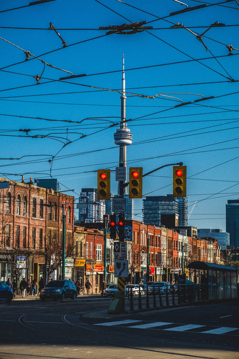 building exterior, fujifilm, street photography, mode of transportation, power line, built structure, toronto, cable, sunset, technology, railroad track