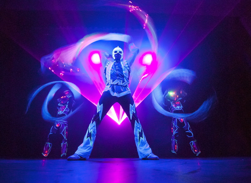 lightshow, people, costume, beautiful woman, night, young Adult, event, light beam, dancing, front view, magician, nightclub, stage light, young women