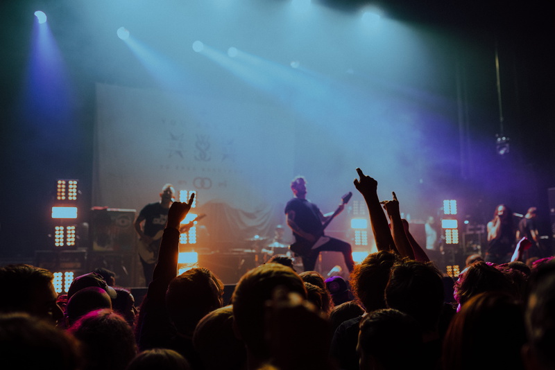 real people, performing, excitement, crowd, large group of people, stage light, spectator, positive emotion, stage - performance space, enjoyment, musicians