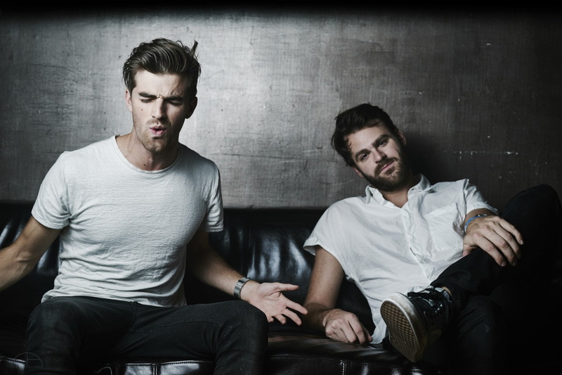 togetherness, The Chainsmokers, relaxation, two people, sitting, young women, three quarter length, young adult, beard, couple - relationship, casual clothing